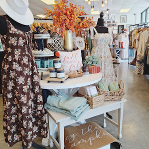 Dresses and gifts in a boutique display